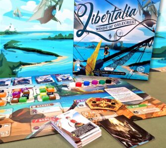 Image of the board game "Libertalia: Winds of Galecrest," featuring the game box, game cards, and various player tokens on a colorful game board. The background showcases a vibrant seascape with ships and islands, emphasizing the maritime theme of the game.