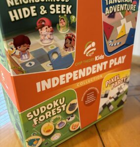 Colorful box of the "Independent Play Collection" by Chip Theory Kids featuring four games: "Neighborhood Hide & Seek," "Tangram Adventure," "Sudoku Forest," and "Pixel Party." The design includes playful characters and vibrant graphics, appealing to children and families.