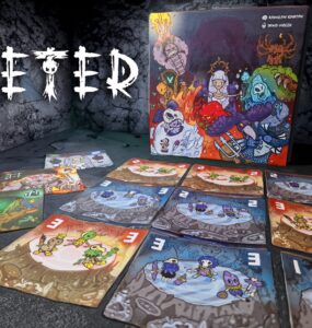 Colorful board game "Eter" with illustrated cards spread out on a textured surface, featuring various characters and vibrant artwork. The game box is prominently displayed in the background, showcasing its creative design. Ideal for tabletop gaming enthusiasts.