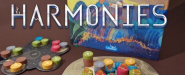 Colorful board game "Harmonies" by Johan Benvenuto featuring vibrant game pieces and a beautifully illustrated box. The game components include a hexagonal board, tokens in various colors, and cards laid out for gameplay, set against a rich brown background.