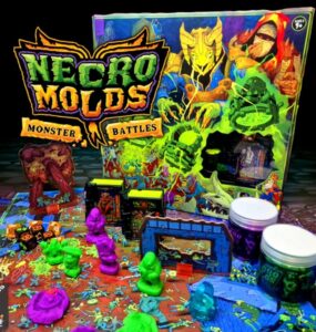 Colorful tabletop game setup of Necro Molds: Monster Battles featuring vibrant monster figures, game pieces, and the eye-catching game box in the background, designed for strategic gameplay and creativity.