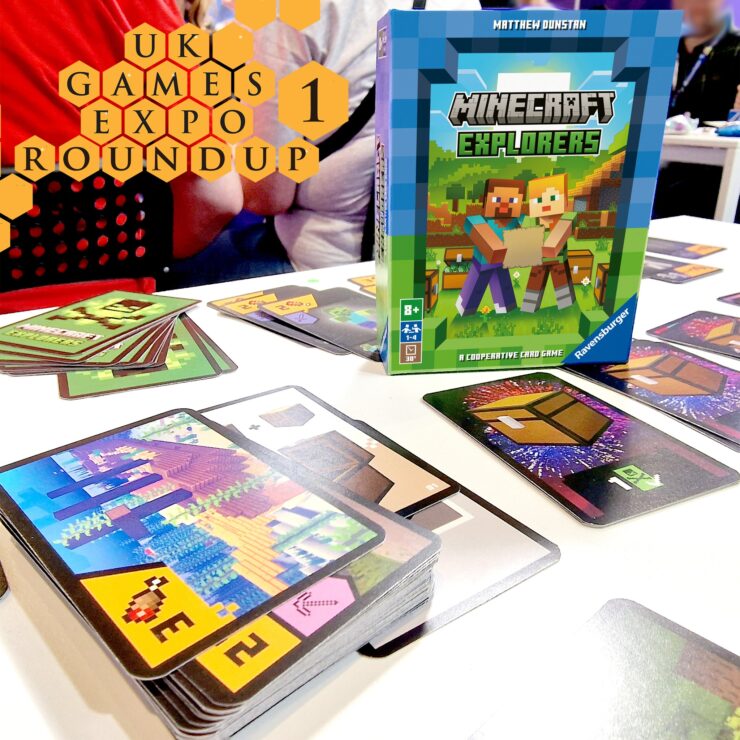 Image of the "Minecraft Explorers" cooperative card game by Ravensburger displayed at the UK Games Expo. The game box is prominently featured alongside various game cards spread out on a table, showcasing colorful graphics and gameplay elements. The background includes blurred figures, hinting at a lively expo atmosphere.