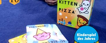 Colorful game box of "Taco Cat Goat Cheese Pizza" displayed at the UK Games Expo 2024, featuring playful illustrations of food characters. Stacked cards include "Ice Cream" design, emphasizing the game's fun and engaging nature. Awarded "Kinderspiel des Jahres 2024," highlighting its popularity among family-friendly games.