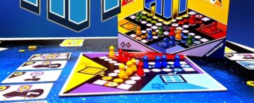 Colorful board game "HIT" by Ralf zur Linde displayed on a vibrant game board with red, yellow, and blue playing pieces. The image features the game box and cards, promoting the Summer Marathon 2024 event.