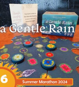 Board game "A Gentle Rain" by Kevin Wilson displayed with game pieces and a promotional card, featuring vibrant floral designs on a puzzle-like game board. The image highlights the game's relaxing theme, suitable for ages 8 and up, and is part of the Summer Marathon 2024 event.