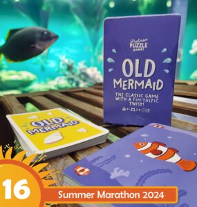 Old Mermaid card game by Professor Puzzle Games displayed on a wooden surface, featuring colorful cards and a vibrant underwater background, promoting Summer Marathon 2024. Suitable for 4+ players, ages 8 and up, with a playful twist on a classic game.