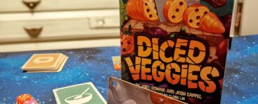 Board game "Diced Veggies" displayed on a colorful tabletop, featuring a vibrant box cover, dice, and cards. The game is designed for 1-4 players, ages 6 and up, with a playtime of approximately 30 minutes. Ideal for family game nights and gatherings.