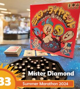Mister Diamond board game displayed on a colorful table during Summer Marathon 2024, featuring vibrant artwork on the box, game cards, and a hexagonal game board with shiny gems.