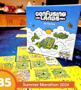 Board game "Confusing Lands" by Zak Eldsvoog displayed on a table with gameplay elements visible, featuring colorful cards and a vibrant design, promoting the Summer Marathon 2024 event.
