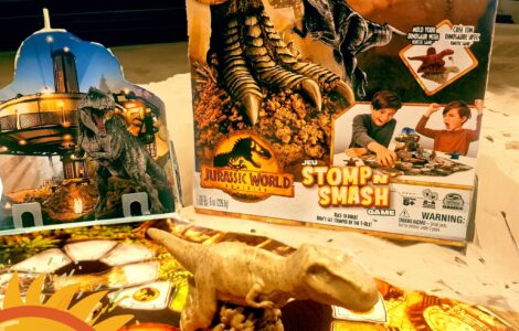 Jurassic World Stomp n Smash game featuring Kinetic Sand, a dinosaur figure, and colorful game board, highlighted for Summer Marathon 2024.