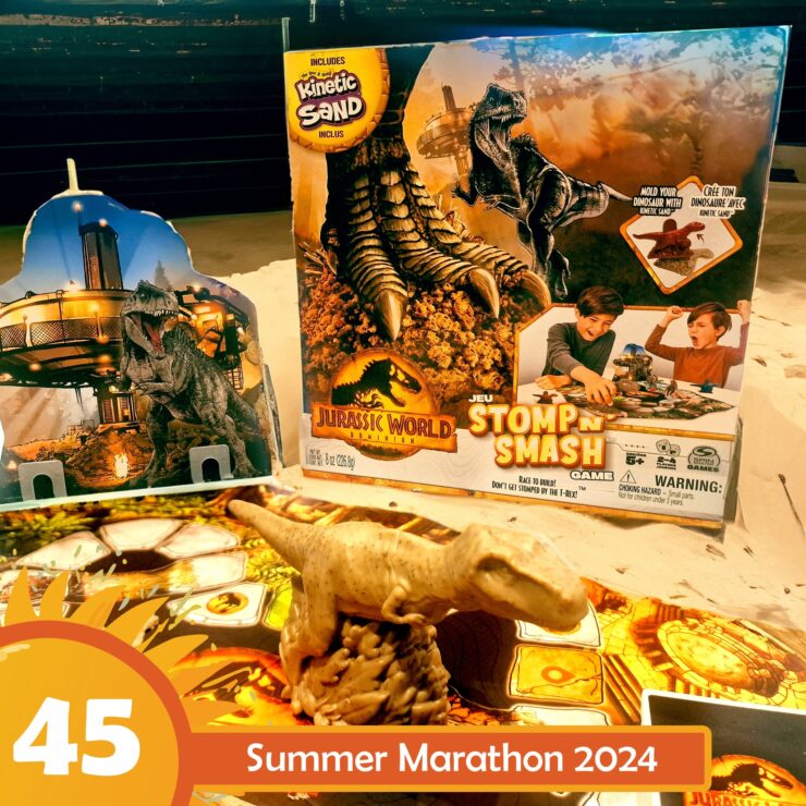 Jurassic World Stomp n Smash game featuring Kinetic Sand, a dinosaur figure, and colorful game board, highlighted for Summer Marathon 2024.