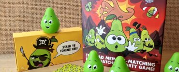 Colorful game components from "Snatching Pears," a memory-matching party game, featuring green pear tokens and themed cards, displayed alongside the game box. Ideal for family game nights and social gatherings.