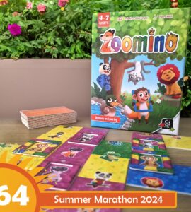 Colorful game "Zoomino" for children aged 4-7, featuring animal-themed dominoes and pairing tiles, displayed alongside the game box and additional tiles on a wooden surface, with a vibrant garden background.