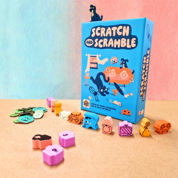 Colorful board game "Scratch and Scramble" displayed with its box and various playful tokens and pieces on a textured surface. The game features whimsical illustrations of animals and objects, making it visually appealing for family game nights.