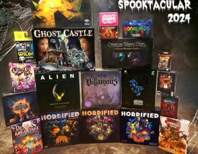 A collection of Halloween-themed board games for 2024, featuring titles like "Ghost Castle," "Alien: Fate of the Nostromo," "Villainous," and "Horrified." The image showcases a vibrant display with game boxes set against a spooky backdrop, perfect for Halloween enthusiasts and board game lovers.