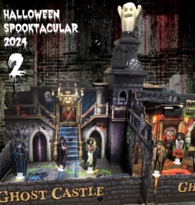 Halloween Spooktacular 2024 features a detailed Ghost Castle playset, complete with spooky decorations, characters, and a ghostly figure atop the turret, perfect for festive celebrations and creative play.