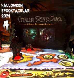 Cthulhu Wars: Duel board game displayed during the Halloween Spooktacular 2024 event, featuring intricate game pieces and a colorful map highlighting locations like Innsmouth and Rockport. The backdrop showcases eerie artwork related to the game, emphasizing its Lovecraftian theme.