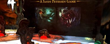 Cthulhu Wars: Duel board game displayed during the Halloween Spooktacular 2024 event, featuring intricate game pieces and a colorful map highlighting locations like Innsmouth and Rockport. The backdrop showcases eerie artwork related to the game, emphasizing its Lovecraftian theme.