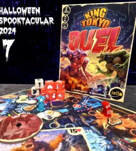 Image of the board game "King of Tokyo Duel," featuring the game box, colorful dice, and game pieces on a vibrant game board. The image includes Halloween-themed text for the "Halloween Spooktacular 2024" event. Ideal for promoting 2-player tabletop gaming experiences.
