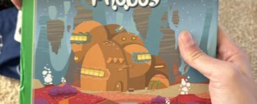 Child holding "The Odyssey of the Phobos" book from the "My First Adventure" series, featuring vibrant space-themed illustrations and engaging storyline. Ideal for young readers seeking interactive storytelling experiences.
