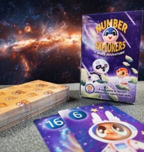 Colorful card game "Number Explorers: A Space Adventure" designed to teach addition and subtraction skills, featuring playful characters and vibrant illustrations against a cosmic background.