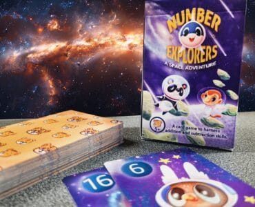 Colorful card game "Number Explorers: A Space Adventure" designed to teach addition and subtraction skills, featuring playful characters and vibrant illustrations against a cosmic background.