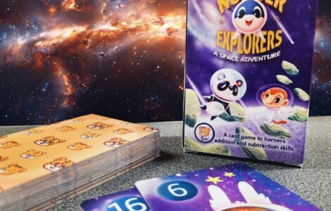 Colorful card game "Number Explorers: A Space Adventure" designed to teach addition and subtraction skills, featuring playful characters and vibrant illustrations against a cosmic background.