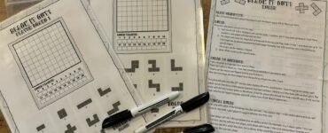 Printable game sheets for "Black It Out!" featuring player boards and game rules. The image showcases two player boards with grids and shapes, along with a rules sheet explaining gameplay and objectives. Markers are placed beside the sheets, ready for use.