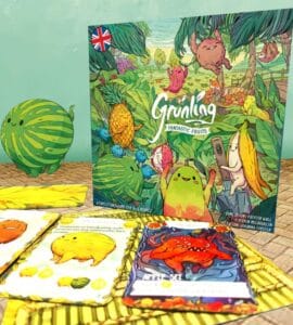Colorful board game "Grünling: Fantastic Fruits" featuring whimsical fruit characters, surrounded by game cards and a playful watermelon illustration. Ideal for family game nights and children’s entertainment.