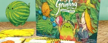 Colorful board game "Grünling: Fantastic Fruits" featuring whimsical fruit characters, surrounded by game cards and a playful watermelon illustration. Ideal for family game nights and children’s entertainment.
