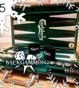 Backgammon game set featuring a green Carlsberg-themed board, dice, and game pieces, with decorative snowflakes in the background. Perfect for holiday gatherings and game nights.
