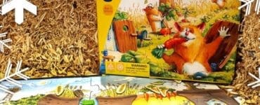 Colorful board game "Hamster Clan" by HABA displayed on a straw background, featuring game pieces and a vibrant game board, suitable for ages 4 and up.