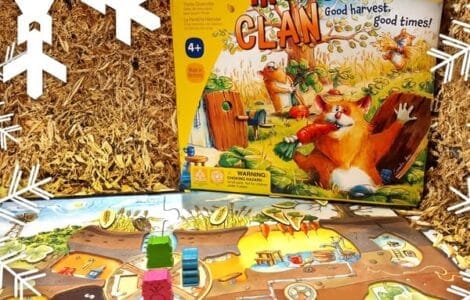 Colorful board game "Hamster Clan" by HABA displayed on a straw background, featuring game pieces and a vibrant game board, suitable for ages 4 and up.