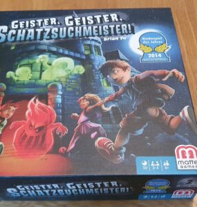 Colorful board game box of "Geister, Geister, Schatzsuchmeister!" designed by Brian Yu, featuring playful children interacting with ghosts. The box highlights the game's awards and includes details such as player count (2-4), playtime (30 minutes), and recommended age (8+).