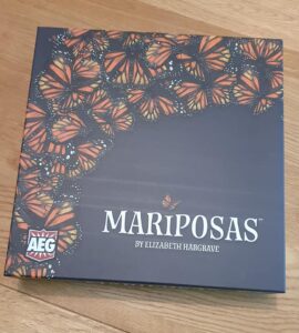 Game box for "Mariposas" by Elizabeth Hargrave, featuring a vibrant design of orange and black butterflies on a dark background, with the AEG logo in the corner.