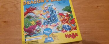 Colorful board game box of "Dragon's Breath" by HABA, featuring playful dragons and a sparkling gem theme, awarded the 2018 Children's Game of the Year.
