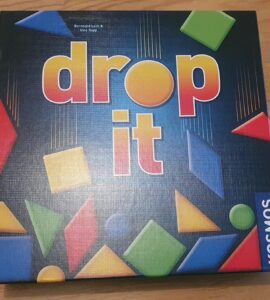 Board game "Drop It" by Bernhard Lurch and Uwe Rapp, featuring colorful geometric shapes on the box cover, published by Kosmos. Ideal for family game nights and strategic gameplay.