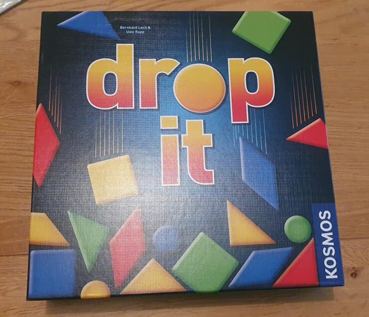 Board game "Drop It" by Bernhard Lurch and Uwe Rapp, featuring colorful geometric shapes on the box cover, published by Kosmos. Ideal for family game nights and strategic gameplay.