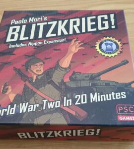 Board game box for "Blitzkrieg!" by Paolo Mori, featuring artwork of a soldier and a tank, highlighting its theme of World War II strategy gameplay in 20 minutes, with the Nippon expansion included.