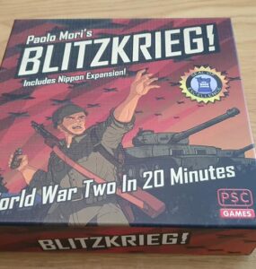 Board game box for "Blitzkrieg!" by Paolo Mori, featuring artwork of a soldier and a tank, highlighting its theme of World War II strategy gameplay in 20 minutes, with the Nippon expansion included.