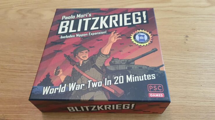 Board game box for "Blitzkrieg!" by Paolo Mori, featuring artwork of a soldier and a tank, highlighting its theme of World War II strategy gameplay in 20 minutes, with the Nippon expansion included.