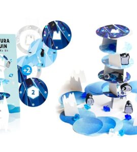 Mini Yura Yura Penguin game featuring colorful stacking pieces and penguin characters on a blue ice-themed background. The game box displays vibrant graphics and includes elements for balance and strategy. Ideal for family fun and educational play.