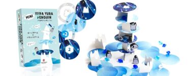 Mini Yura Yura Penguin game featuring colorful stacking pieces and penguin characters on a blue ice-themed background. The game box displays vibrant graphics and includes elements for balance and strategy. Ideal for family fun and educational play.