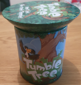 Tumble Tree game box featuring vibrant illustrations of a tree and a bird, designed for family-friendly fun and skill-building activities.