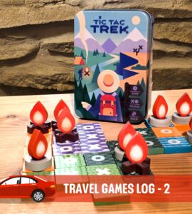 Tic Tac Trek travel game displayed on a wooden table, featuring a vibrant game box and unique game pieces shaped like flames and tokens. Ideal for two players, ages 8 and up, with a playtime of 15 minutes. Perfect for on-the-go family fun.