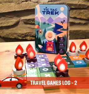 Tic Tac Trek travel game displayed on a wooden table, featuring a vibrant game box and unique game pieces shaped like flames and tokens. Ideal for two players, ages 8 and up, with a playtime of 15 minutes. Perfect for on-the-go family fun.