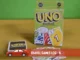 UNO card game box with "House Rules" edition displayed alongside game cards on a colorful background, ideal for travel game log inspiration.