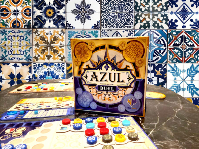 Azul Duel board game on a table with portugese tiles in the background.