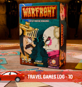 Box of the board game "Warfront: Fantasy Warfare Reimagined" by Hector Clegg, displayed on a tabletop surrounded by game cards and components. The stylish artwork features vibrant colors and characters, highlighting the game's unique theme. Ideal for travel gaming enthusiasts.