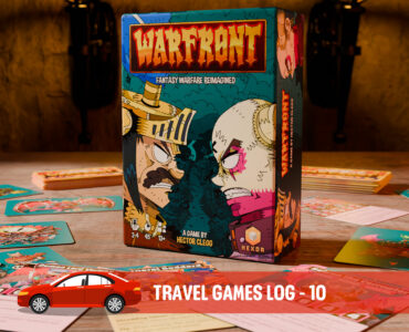 Box of the board game "Warfront: Fantasy Warfare Reimagined" by Hector Clegg, displayed on a tabletop surrounded by game cards and components. The stylish artwork features vibrant colors and characters, highlighting the game's unique theme. Ideal for travel gaming enthusiasts.